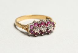 AN 18CT GOLD, DIAMOND AND RUBY RING.