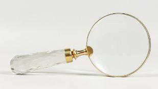 A MAGNIFYING GLASS with cut glass handle.