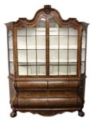 A GOOD LATE 18TH CENTURY DUTCH FIGURED WALNUT VITRINE, with shaped top, two glazed doors enclosing