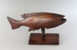 A CARVED WOOD PITCAIRN ISLAND FISH. 12ins long.