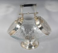 A CUT GLASS AND PLATE DOUBLE-ENDED BISCUIT BOX on a circular base. 11ins long.