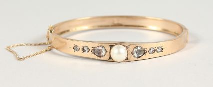 A SUPERB GOLD, DIAMOND AND PEARL BRACELET, set with a central pearl and diamond.
