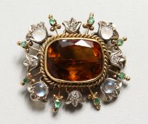 A VICTORIAN CITRINE AND MOONSTONE BROOCH.