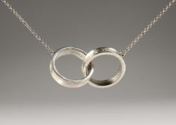 A SILVER TIFFANY and Co. ENTWINED RING NECKLACE.