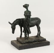 A BRONZE GIRL WITH A DONKEY on a marble base.