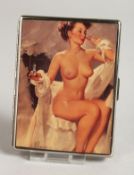 A METAL ENGINE TURNED CIGARETTE CASE. the top with a glamour model, seated nude.