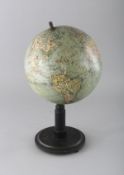A COLUMBUS VOLKS GLOBE on a stand. 7ins diameter.