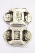 Two pieces of Chinese white metal money.