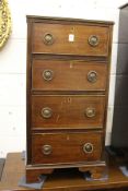 A mahogany small narrow four drawer chest.