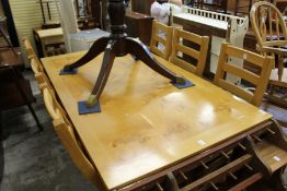 A good modern oak dining table with six ladder back chairs.