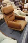 A Charles Eames style swivel armchair.