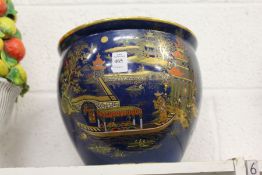 A Carlton ware lustre decorated Chinese style jardiniere.