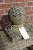 A composite stone garden finial.