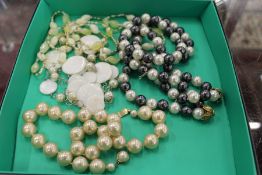 Four decorative bead necklaces.