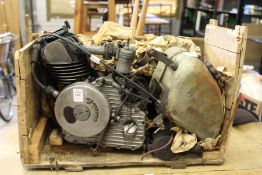 An unusual small Ducati Cucciolo petrol engine in remnants of original crate.