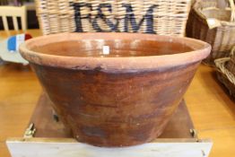 A good large terracotta circular bowl.
