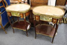 A pair of French kidney shaped marble top two tier single drawer occasional tables.