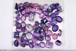 A quantity of cut amethyst and kunzite stones.