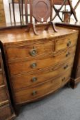 A George III mahogany bow front chest of two short and three graduated long drawers on splay bracket
