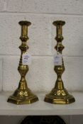 A pair of brass candlesticks.