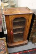 A Victorian inlaid walnut music cabinet.