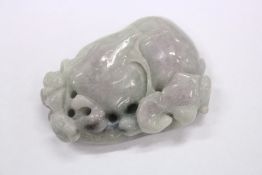A carved jade amulet.