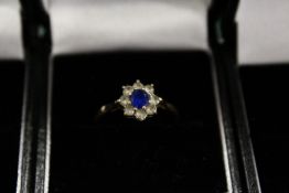 A 9ct gold diamond and sapphire ring.