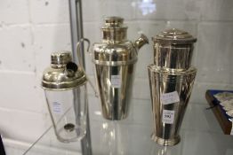 Three various cocktail shakers.