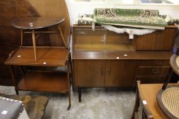 An Ercol occasional table and a 1960's trolley and bookcase unit.