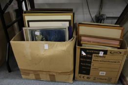 Two boxes of paintings and prints.