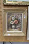 T. Denver, a still life of flowers in a vase, oil on canvas, signed.