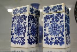 A pair of Chinese blue and white square shaped boxes and covers.