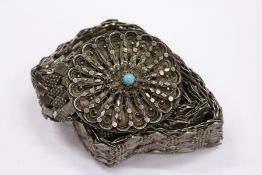 An eastern white metal belt.