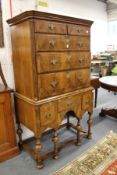 An 18th century walnut chest on later stand comprising two short and three graduated long drawers,