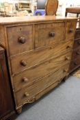 A Scottish chest of drawers comprising three deep drawers over three graduated drawers with a shaped
