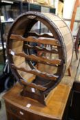 A barrel shaped wine rack.