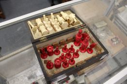 An early 20th century stained ivory chess set (lacking one white pawn).