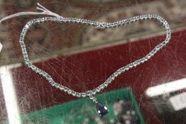 A decorative silver necklace.
