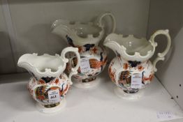 A graduated set of three Imari decorated jugs (from the Murray collection).