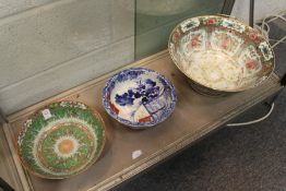Three Chinese and Japanese bowls.