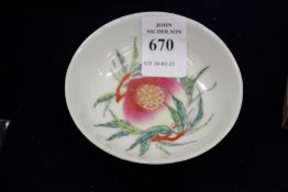 A good small Chinese circular bowl decorated with a peach, six character mark to the base.