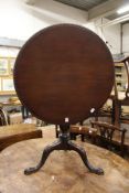 A George III and later mahogany circular bird cage tripod table.