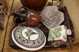 A Persian circular pottery plaque and other similar items.