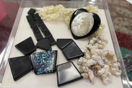 Three decorative necklaces.