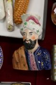 A Staffordshire spill vase modelled as a bust of a Turkish man.