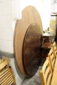 A Regency style large circular pedestal dining table together with a larger plywood folding