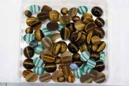 Various cabochon tiger's eye and other items.