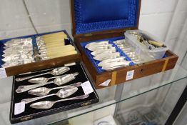 Silver napkins rings, a cased fish set, grapefruit spoons etc.