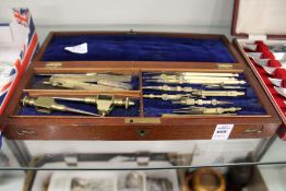 Mahogany cased drawing instruments.