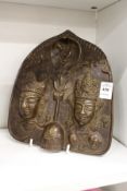An Indian bronze relief cast hanging panel depicting figures.